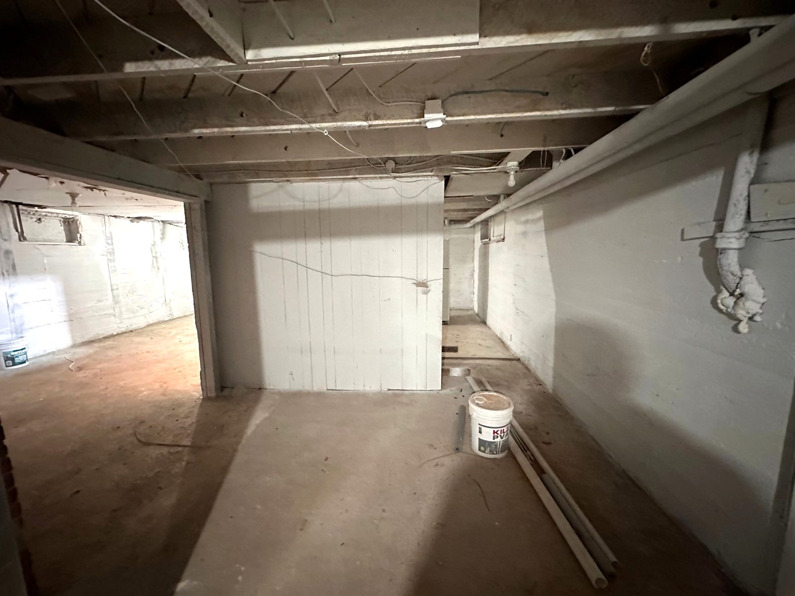 After: basement foundation walls cleaned up and painted white, Fort Morgan