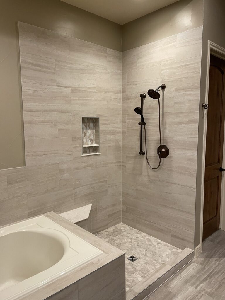 Centennial bathroom remodel with tiled shower and tub by Brimie Contractors
