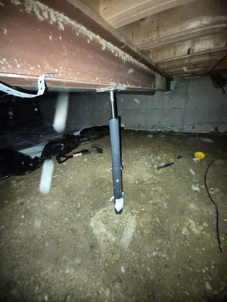Before: undersized gray adjustable post under the crawlspace beam, Centennial