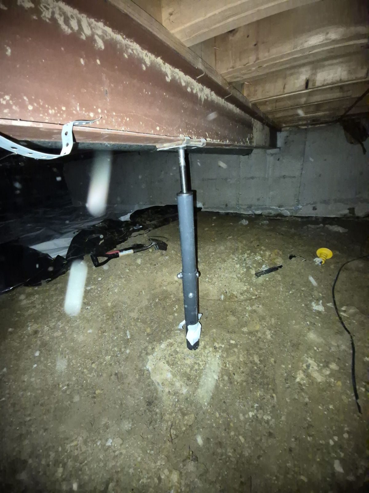 Before: undersized gray adjustable post under the crawlspace beam, Centennial