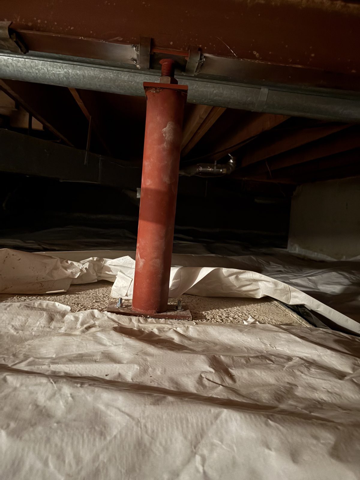 After: new red steel post supporting the crawlspace beam, Centennial