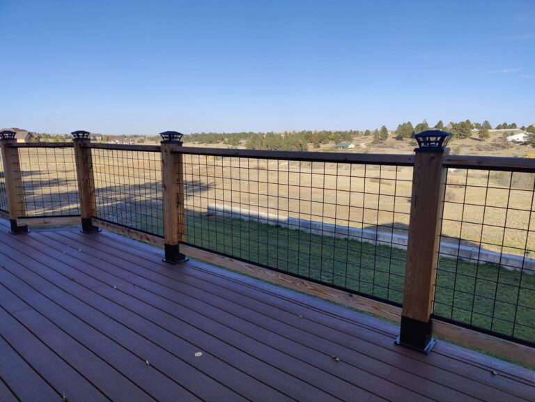 Composite deck with wood and hog-wire railing by Brimie Contractors