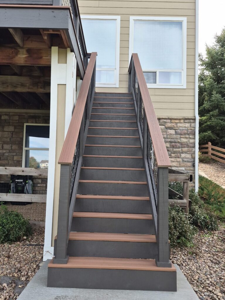 Deck stairs with composite treads and hog-wire railing by Brimie Contractors