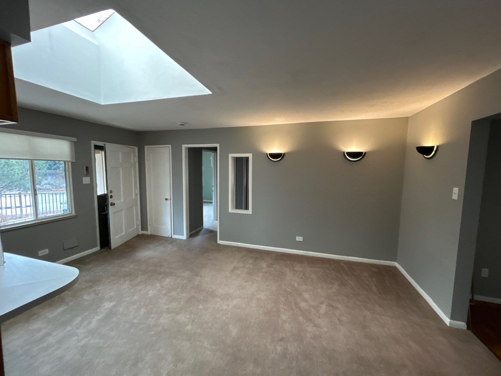 Before: carpeted living room with gray walls, Denver