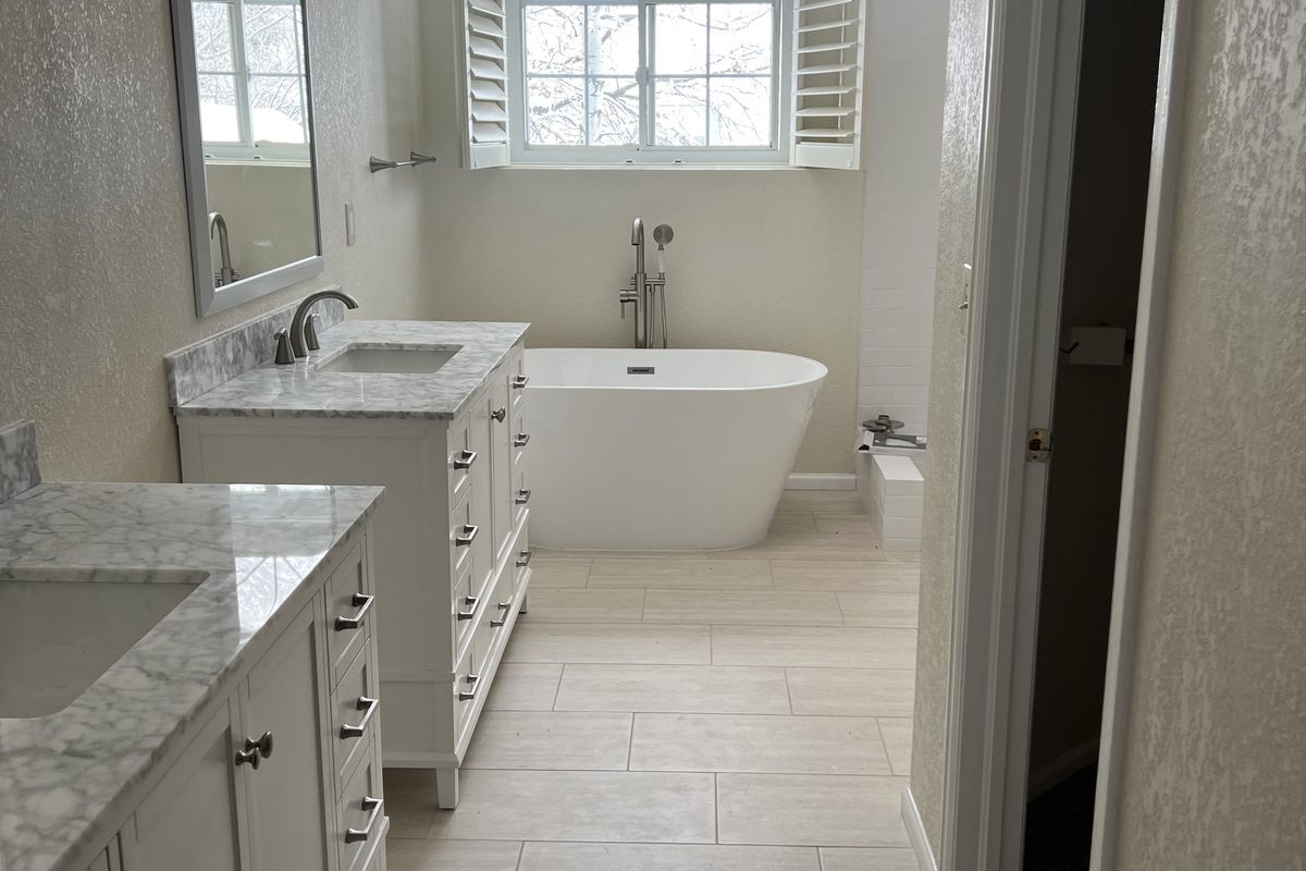 Highlands Ranch bathroom remodel with freestanding tub and tile floor by Brimie Contractors