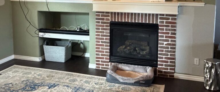 Before: brick fireplace with painted mantel and TV ledge, Highlands Ranch