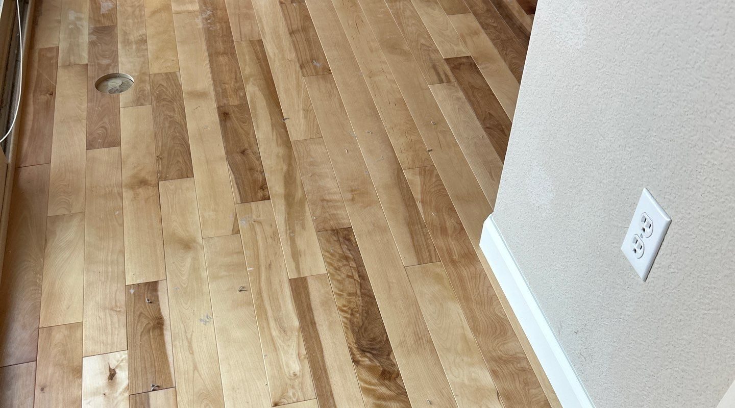 New natural birch hardwood with white base trim, Highlands Ranch