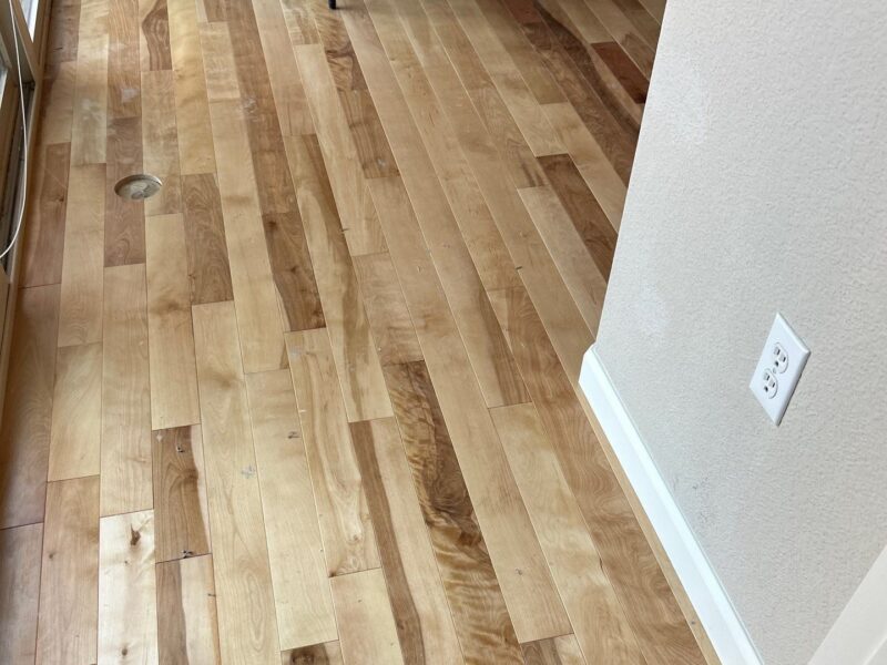 New natural birch hardwood with white base trim, Highlands Ranch