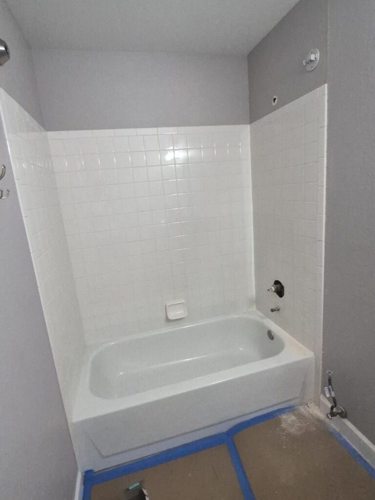 Before: Highlands Ranch hall bath with tile tub surround, ready for a tub-to-shower conversion