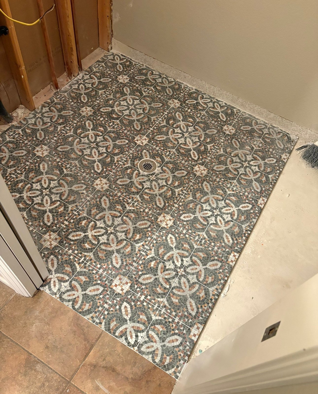 Mosaic-pattern laundry room tile floor going in, Highlands Ranch townhome