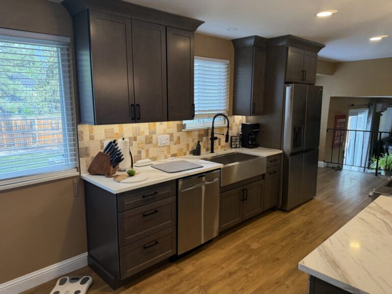 Littleton kitchen remodel with dark shaker cabinets and farmhouse sink by Brimie Contractors