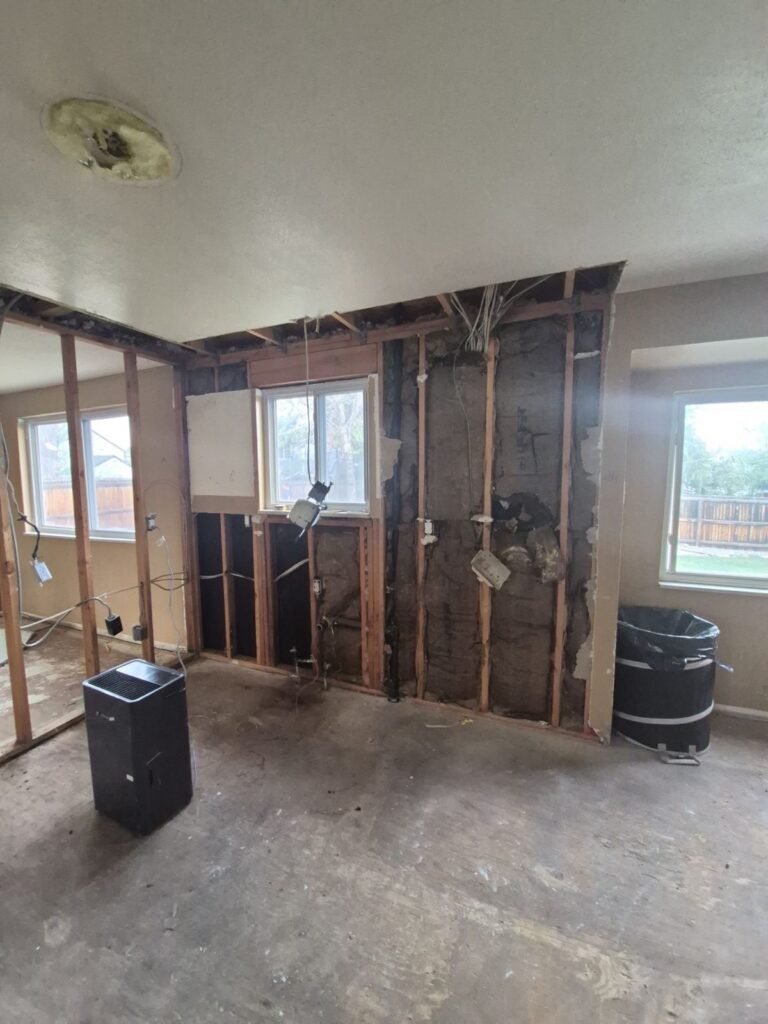 Littleton kitchen remodel during demolition, with the wall opened up and new wiring run