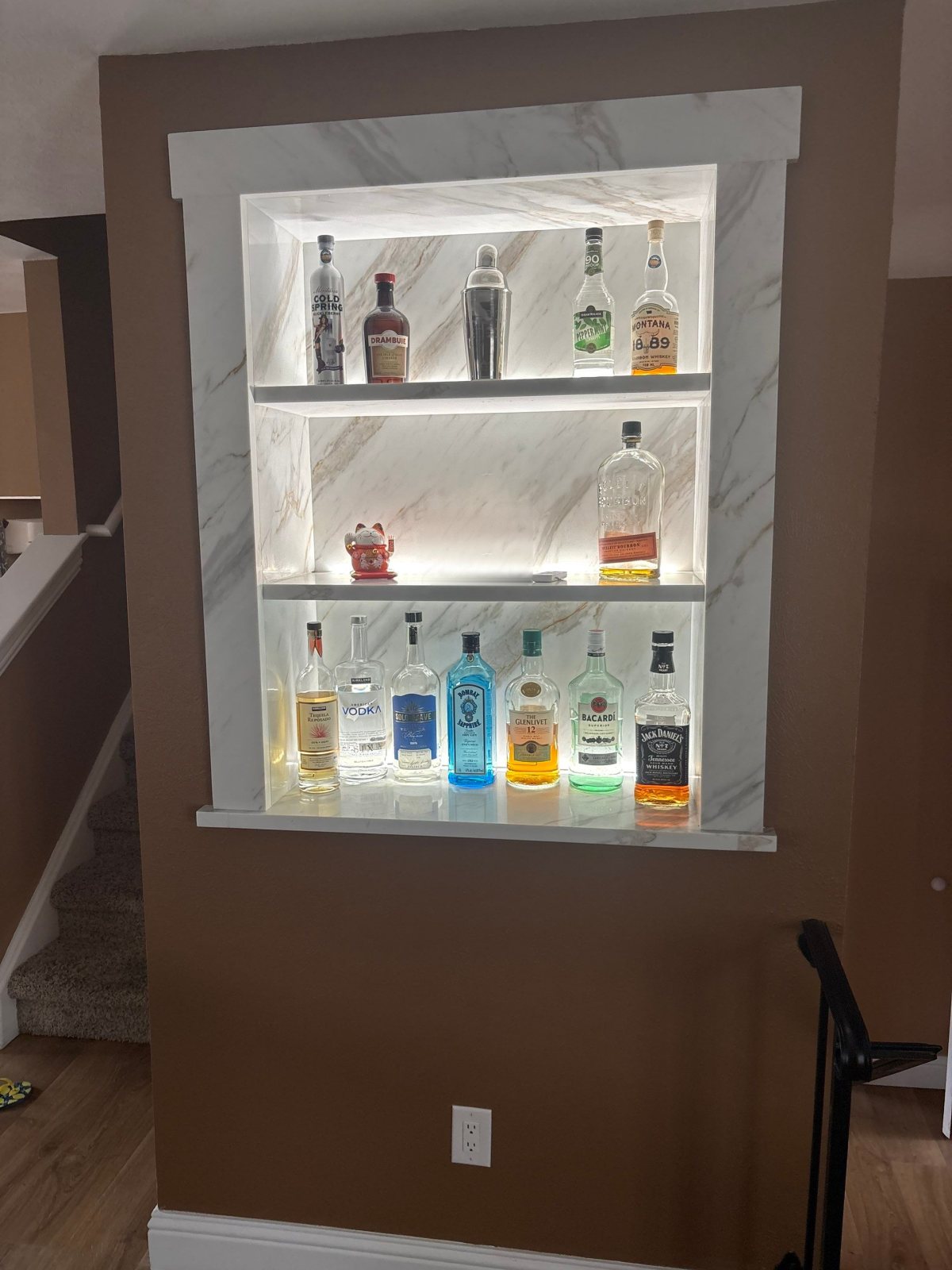 After: Littleton lighted bar niche with marble-look quartz shelves and LED lighting