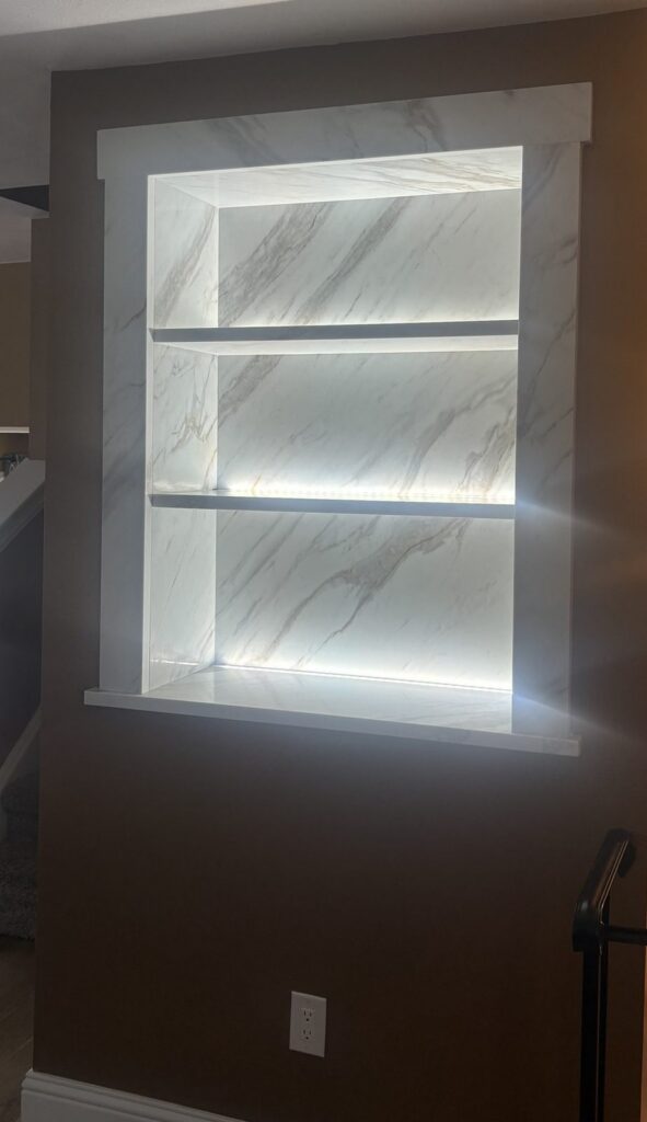 Custom LED-lit quartz wall niche in Littleton by Brimie Contractors