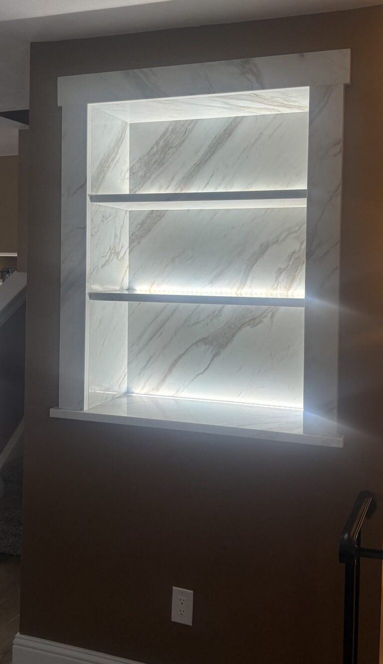 Custom LED-lit quartz wall niche in Littleton by Brimie Contractors