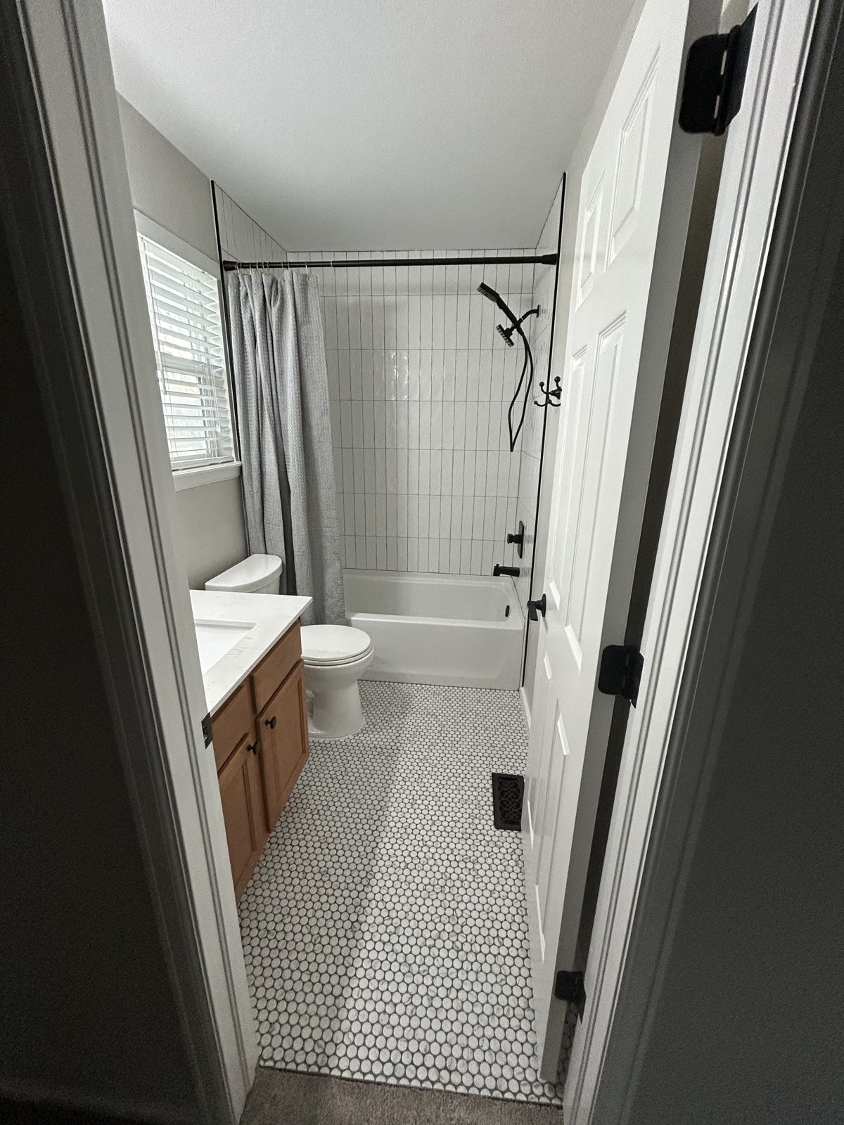 Parker hall bathroom remodel by Brimie Contractors, view from the doorway