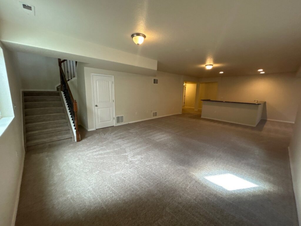 After: basement family room with fresh paint