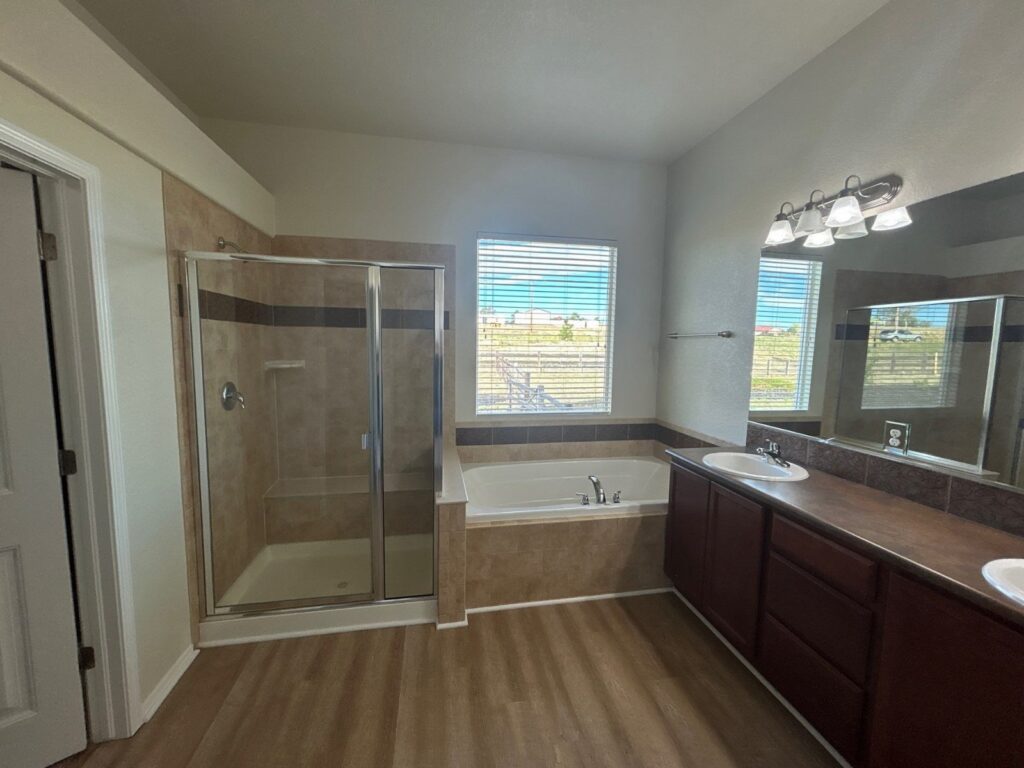 After: primary bath, re-caulked and ready to list